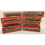 8 boxed OO gauge model railway carriages by Hornby.