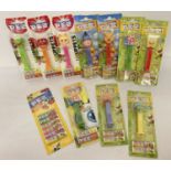 A collection of 10 assorted Pez sweet dispensers in blister packs.