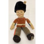 A vintage Norah Wellings 8" Royal Guard rag doll with velveteen clothing.