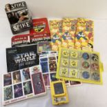 A collection of assorted stickers, trading cards boxes, collectors files and games.