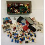 2 boxes of assorted vintage Lego accessory pieces.