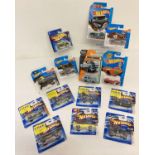 13 Hotwheels cars and a Matchbox car to include Batmobile, The Bat, Scoopa Di Fuego and Mig Rig.
