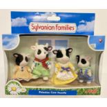 A boxed and unopened Flair Toys Sylvanian Families retired Friesian Cow family, #4167.