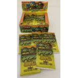 A box containing 31 packs of sealed and unopened Teenage Mutant Ninja Turtles trading cards.