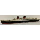 A vintage painted wooden model of a passenger liner.