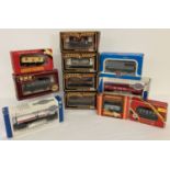 A collection of 11 boxed OO gauge model railway wagons to include tankers.