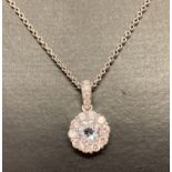 A 18ct white gold aquamarine and diamond pendant necklace by Luke Stockley London.