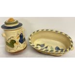 2 pieces of modern studio pottery with yellow glaze and hand painted bird detail.