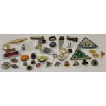 A collection of vintage pins badges, cloth badges and other small misc. items.