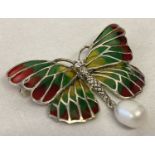 A 925 silver butterfly brooch with coloured translucent enamelled wings and pearl drop pendant.