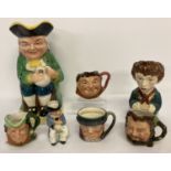 A collection of 7 assorted vintage ceramic toby jugs to include Royal Doulton and Cooper Clayton.