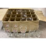 A box of assorted beer pint glasses to include: Kronenburg, Strongbow & Bulmer's.
