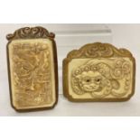 2 small Oriental carved bone plaques set into decorative wooden mounts.