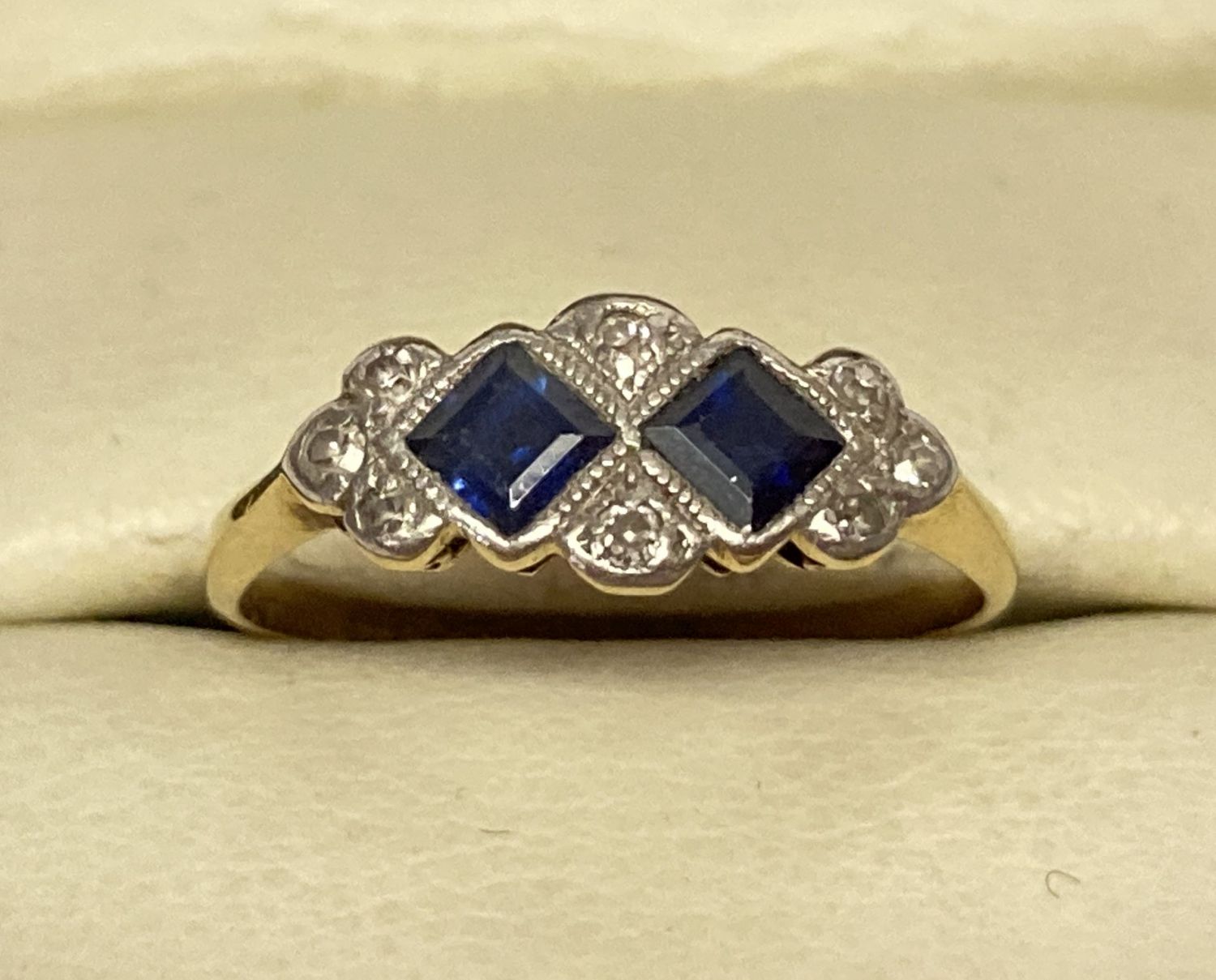 An Art Deco 18ct gold, sapphire and diamond dress ring.