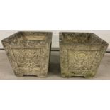 A pair of Cotswold Studios U29 square stone planters with carved rose detail to all four sides.