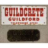 A cast iron nameplate for "Grant BS3377 1985 W/P Bar" together with a vintage enamel sign.