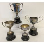 A small silver trophy cup on a black plastic stand hallmarked Birmingham 1932.