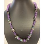A very fine amethyst and fresh water peacock keshi pearl 20" necklace.