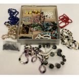 A quantity of assorted vintage beaded necklaces.