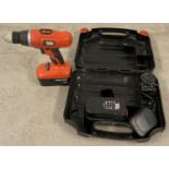 A black and Decker cordless drill set with 2 batteries and charger in original case.