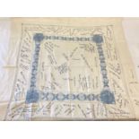 An antique linen table cloth with hand embroidered signatures and place names throughout.