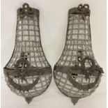 A pair of heavily beaded Empire style wall lights with metal floral swag detail.