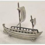 A miniature silver model of a sailing ship, marked 925.