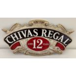 A Chivas Regal Scotch whisky painted cast metal wall hanging plaque.