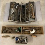 A metal cantilever toolbox and contents to include adjustable spanners and other spanners.