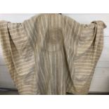 A large tribal style heavy linen robe with embroidery and panel detail in neutral tones.