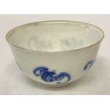 A small Chinese blue & white ceramic tea bowl with hand painted fu bat design.
