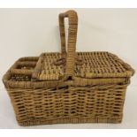 A modern wicker picnic basket with lift up lid and wine bottle compartments.