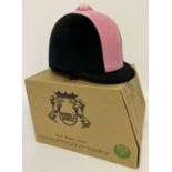 A brand new in box pink and black riding helmet by Double Horse.