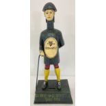 A painted cast iron Guinness advertising figural money box.