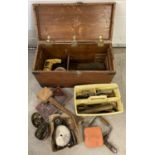 A vintage pine metal banded tool chest with carry handles and contents.