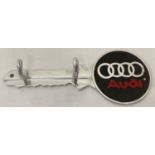 An Audi cars aluminium key shaped wall hanging key hook, with black & red painted detail.
