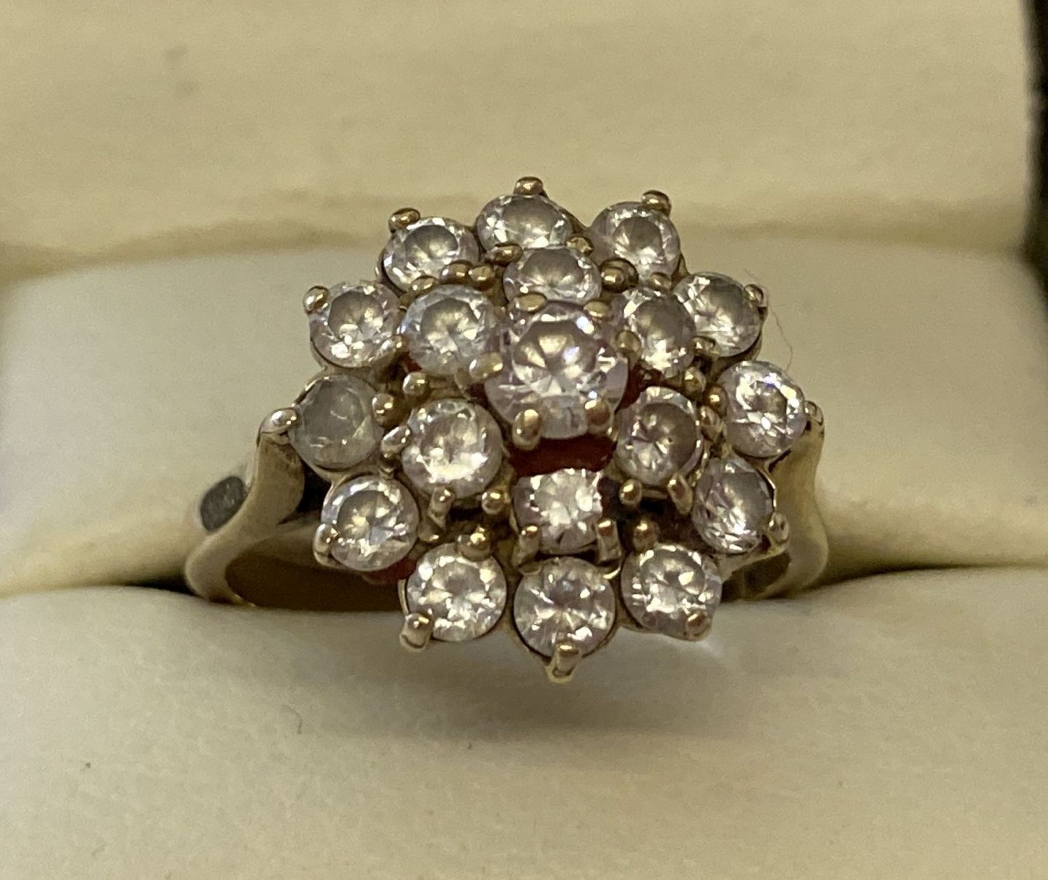 A 9ct gold and clear stone large cluster style dress ring.