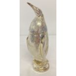 A heavy silver plated, screw top sugar sifter in the form of a penguin.
