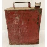 A vintage Pratts petrol can, painted red, with original brass screw lid.