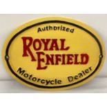 A cast iron oval shaped Royal Enfield motorcycles wall plaque.
