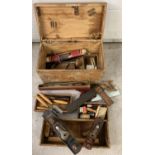 A vintage hardwood tool chest with interior trays and vintage tools.
