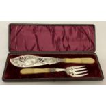 Antique silver plated fish servers with carved bone handles.