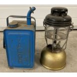 A vintage Tilley lamp together with a blue Valor paraffin can.