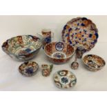 10 pieces of oriental ceramics mostly in orange and blue Imari style floral decoration.