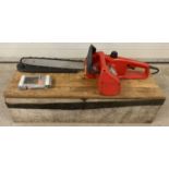 An electric chainsaw by Castell CS17E with 40cm blade.