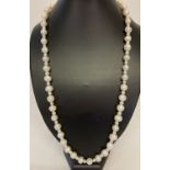 A 26" beaded necklace made from alternating large and small freshwater pearls.