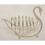 A silver plated toast rack in the shape of a swan, raised on ball feet.
