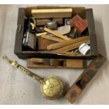 A box of assorted misc. vintage items to include box planes, wooden rules & brass nut roaster.