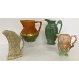A collection of 4 Art Deco pottery jugs to include Carlton Ware, Crown Derby & Falcon Ware.