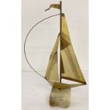 A small mid 20th century brass sail boat sculpture by John & Don DeMott, on a green onyx base.